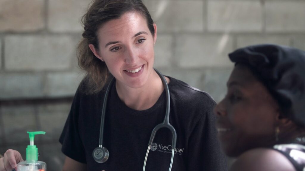 Female doctor talking with woman patient